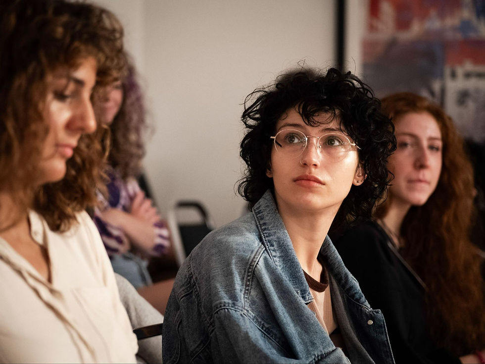 Acting students listening during a class at Maggie Flanigan Studio