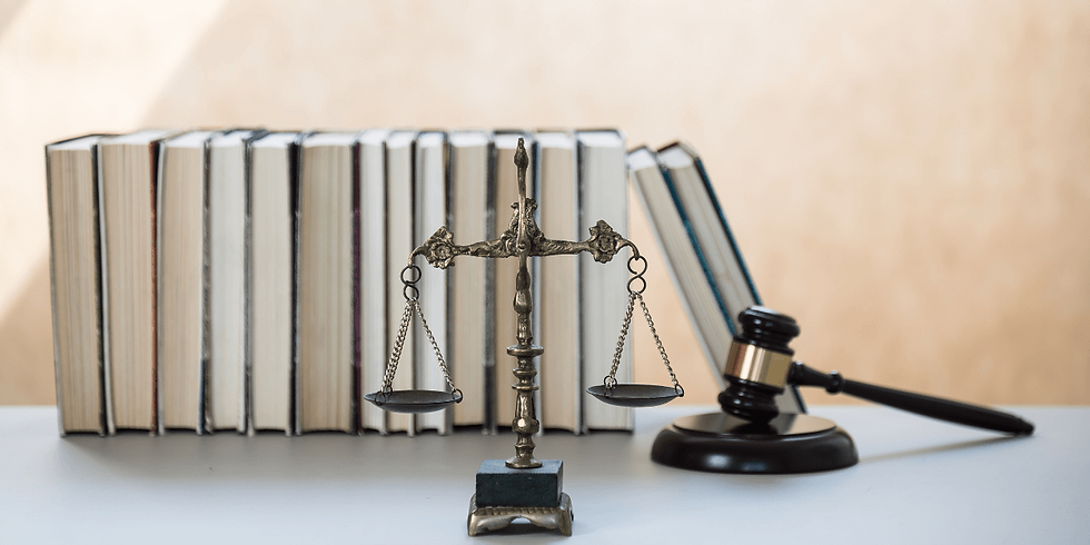 law books on desk with scales and a gavel