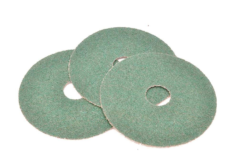 Three green sanding discs for polishing