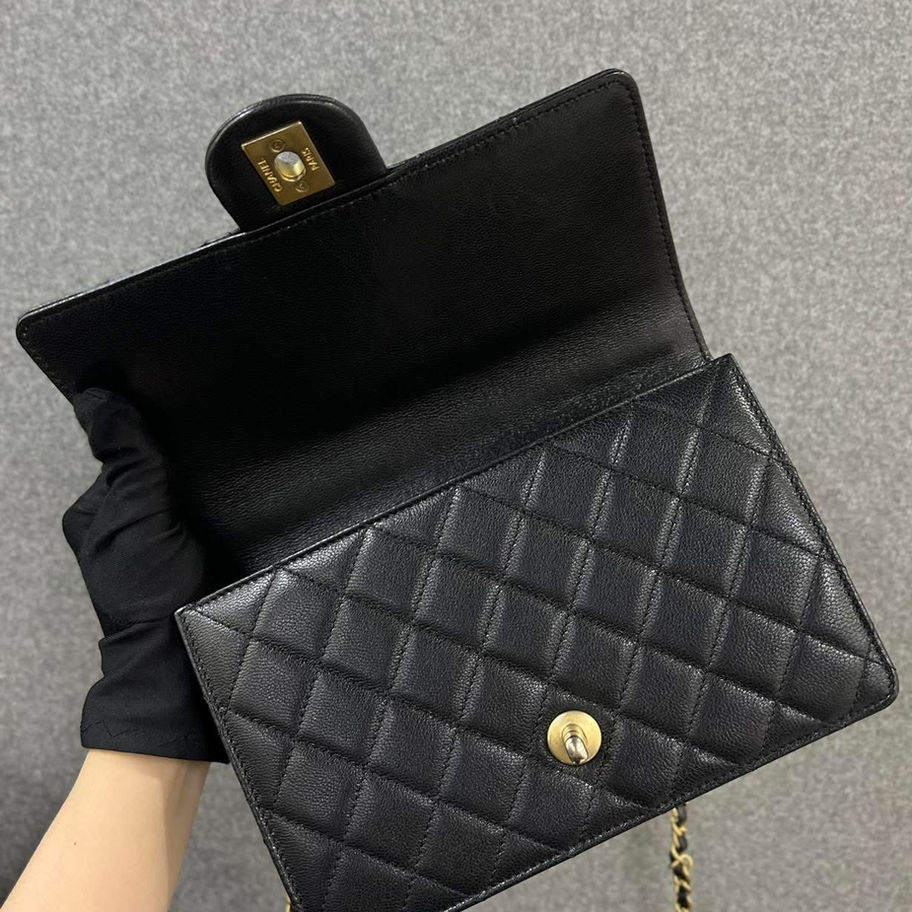Black quilted Chanel mini top handle bag