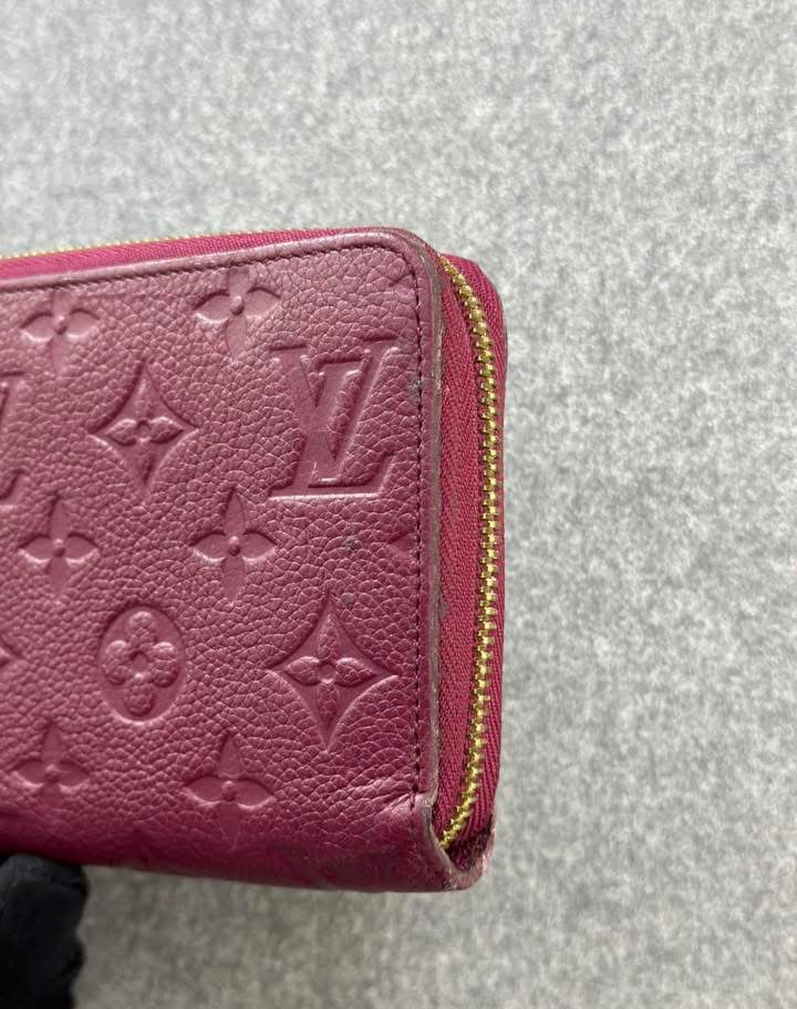 Pink Louis Vuitton Monogram embossed zip wallet