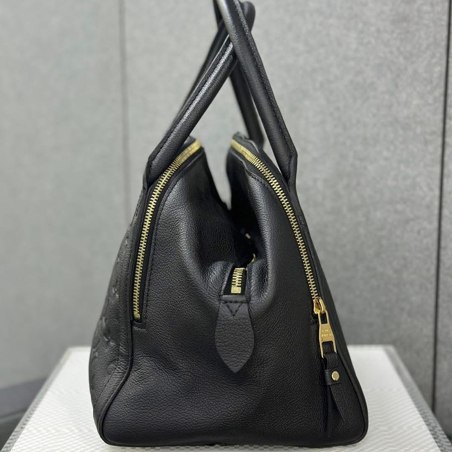 Black leather handbag, side view