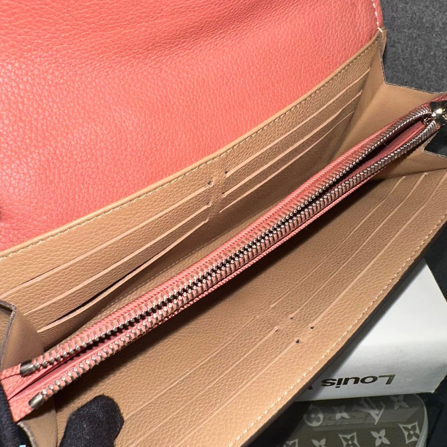 Coral pink Louis Vuitton wallet interior