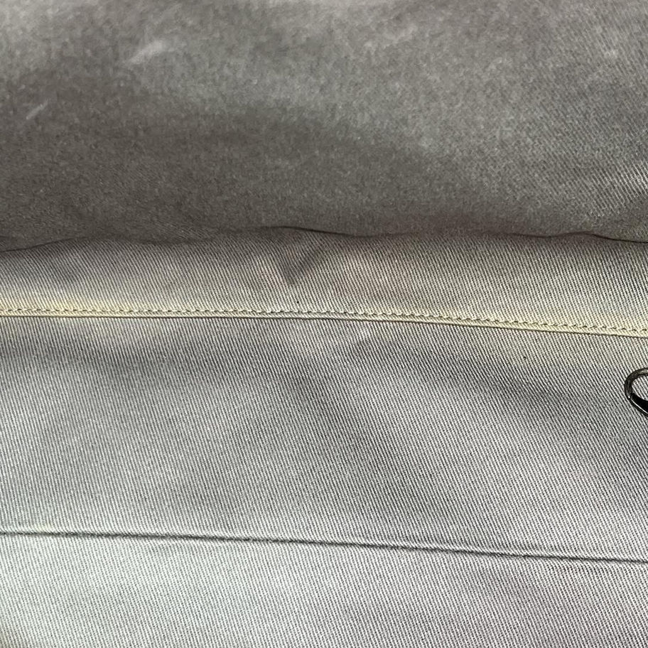 Close-up of light grey fabric seam
