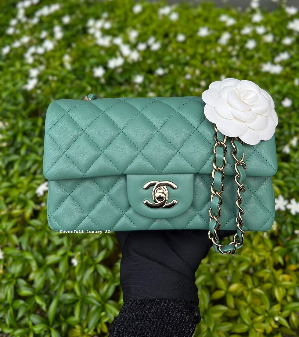 Mint green Chanel handbag with white camellia