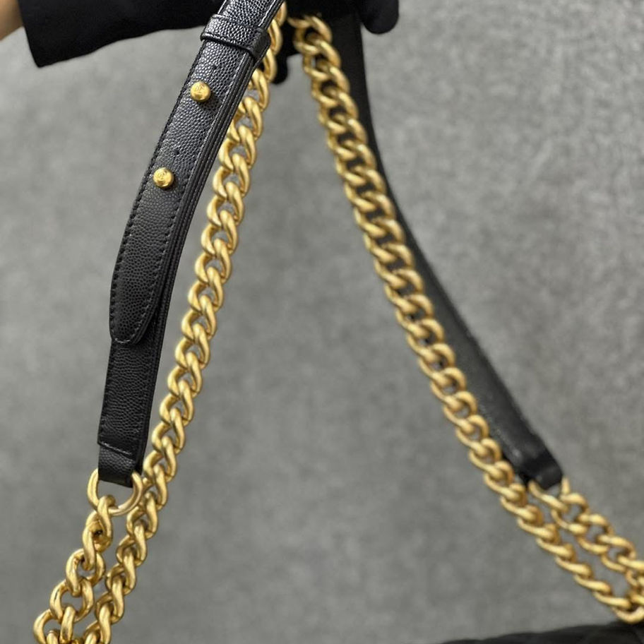 Black leather Chanel clutch with gold chain