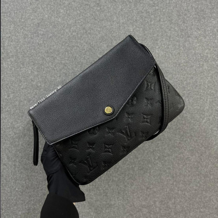 Black Louis Vuitton Monogram Empreinte leather clutch
