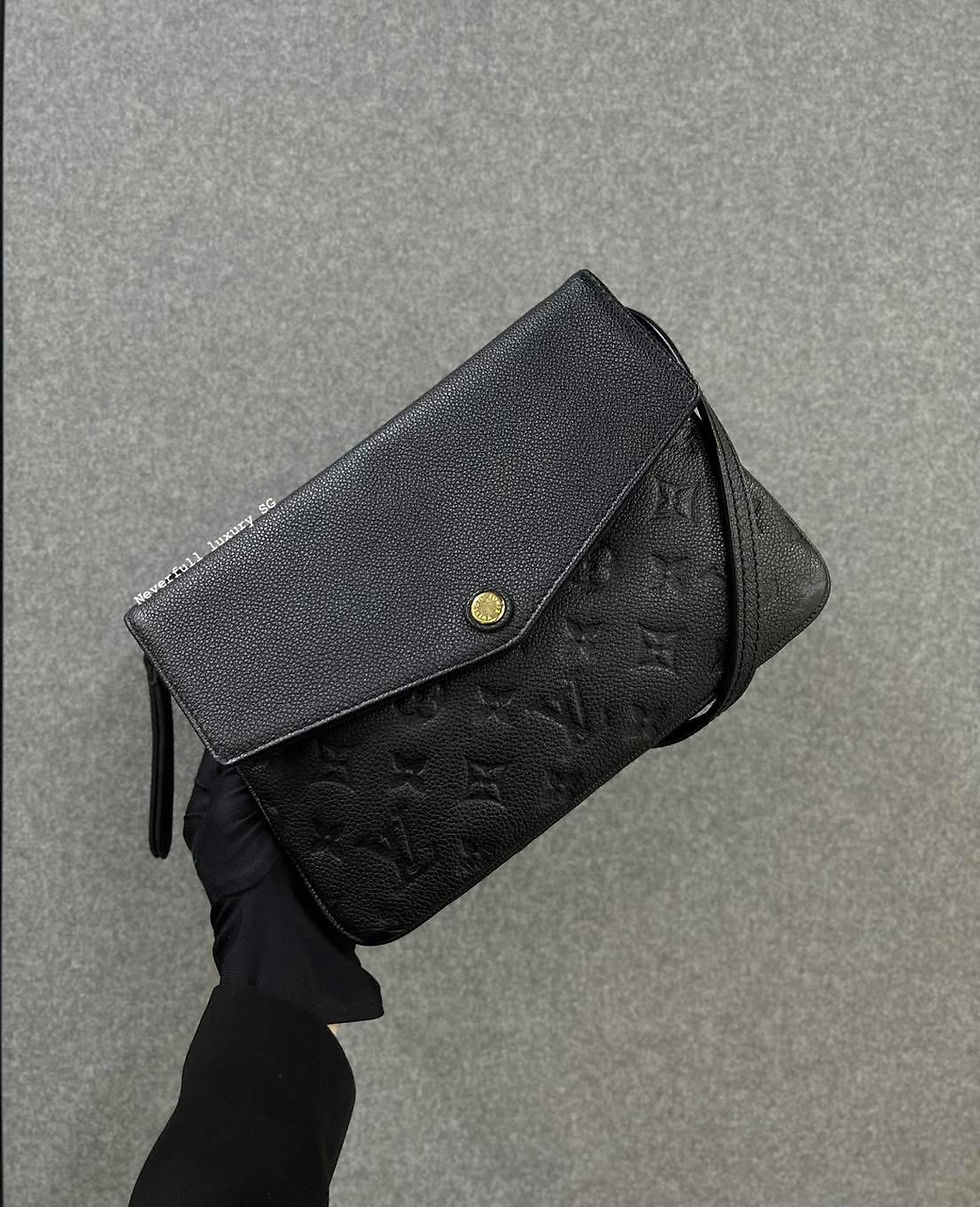 Black Louis Vuitton Monogram Empreinte leather clutch