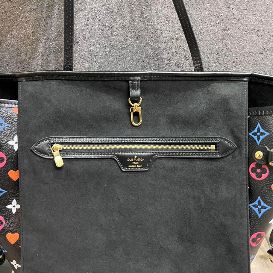Black Louis Vuitton tote bag with zipper and gold accents