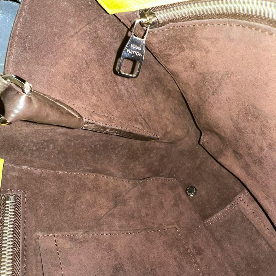 Brown leather handbag interior, zippered pocket