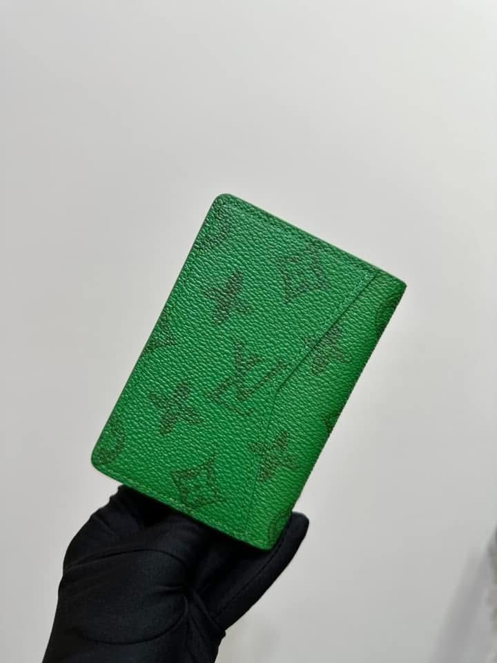 Green leather wallet with embossed logo