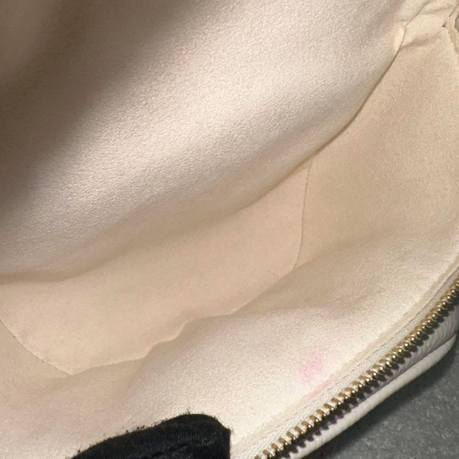 Cream-colored bag interior, spacious and uncluttered