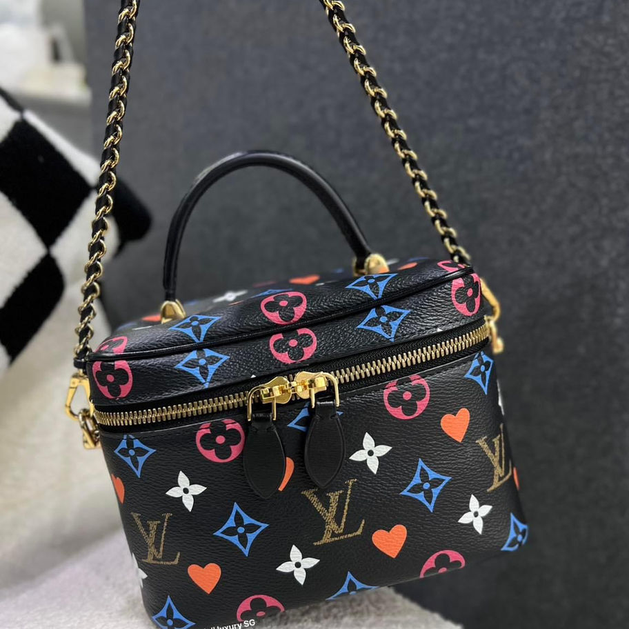Black Louis Vuitton monogram handbag with colorful hearts and flowers