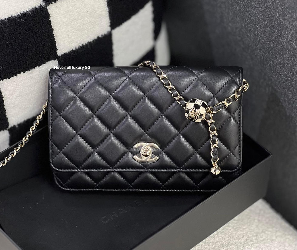 Black quilted Chanel clutch with gold chain