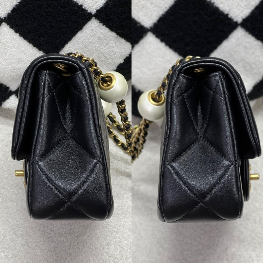 Black quilted Chanel handbag with pearl strap detail
