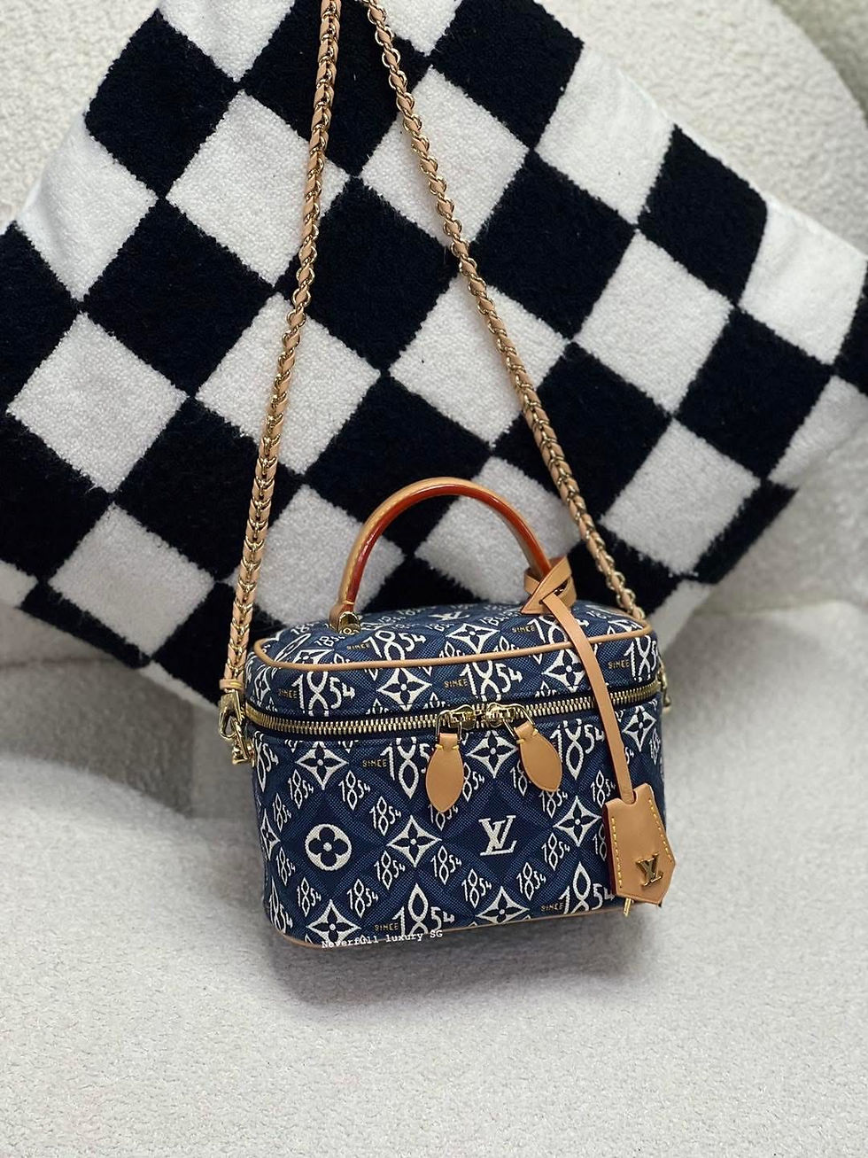 Blue Louis Vuitton vanity case with gold chain