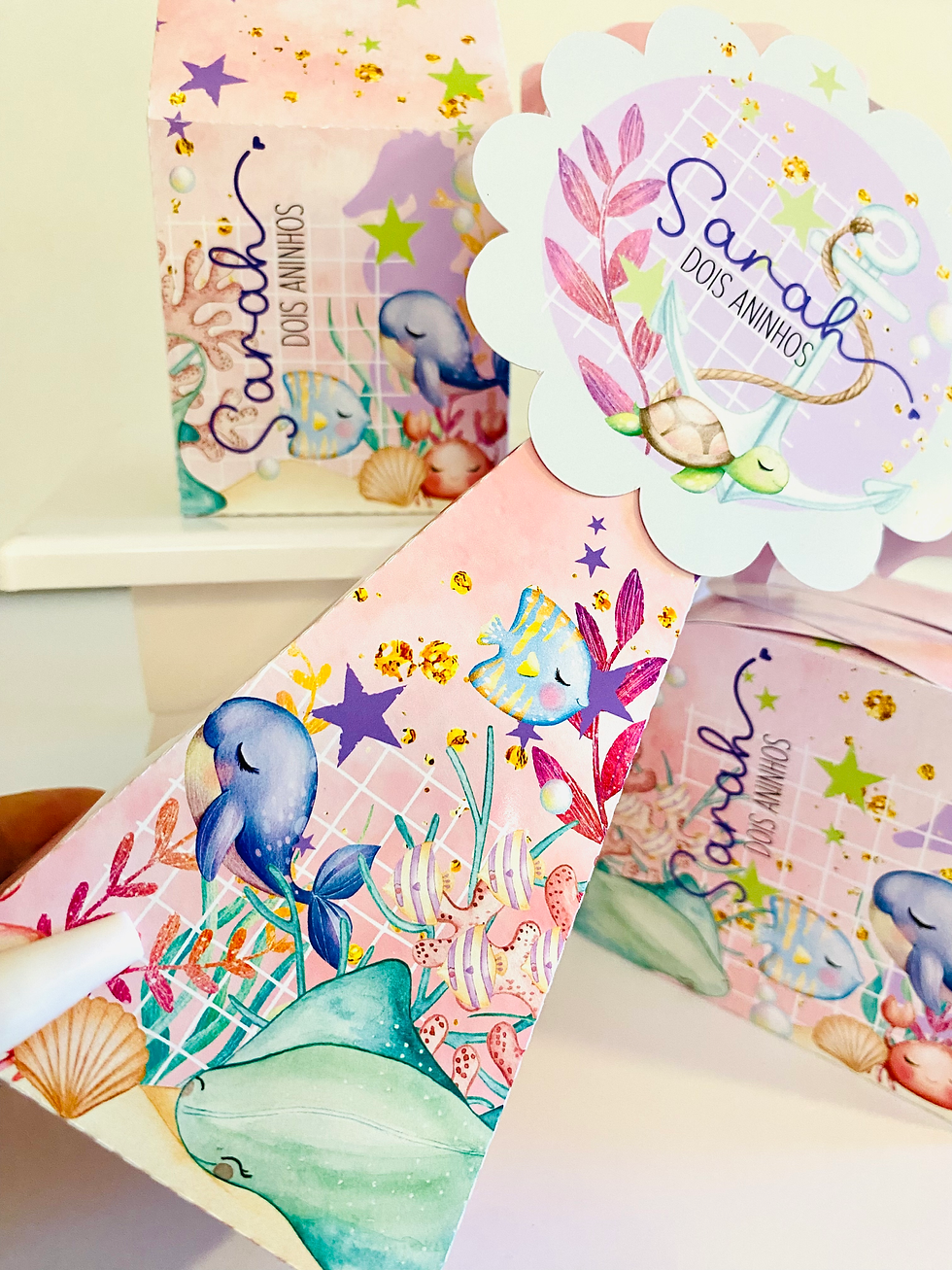 Miniatura: Quatro caixas Fundo do Mar em rosa e lilás, com nome Sarah, animais marinhos, estrelas e topo recortado.