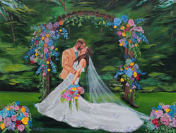 A live wedding painting by Dihel Art of a bride and bride and groom sharing their first kiss outside surrounded by a floral arch.