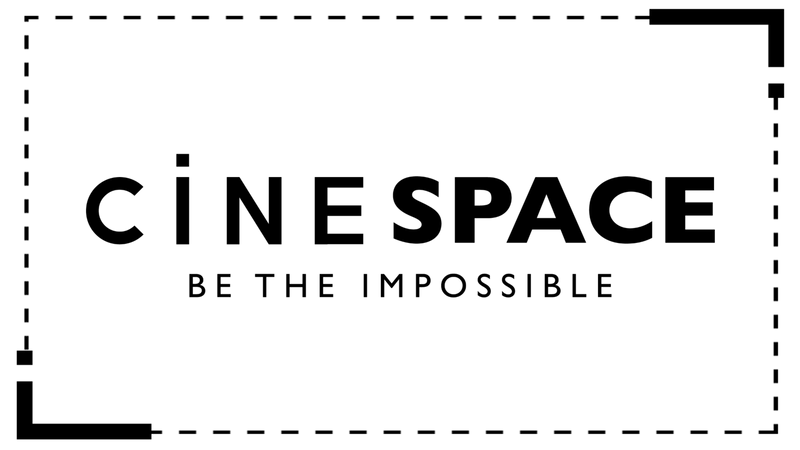 A stylized black film reel icon on a transparent background, symbolizing cinema and film production.
