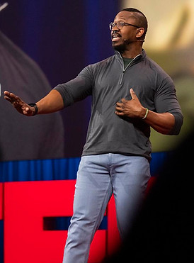Joshua Johnson speaking at TED 2026. Photo: Ryan Lash/TED