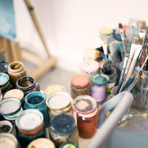 Artist paints and brushes