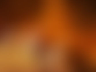 Missiles launch into a smoky orange night sky, trailing bright flames and streaks.