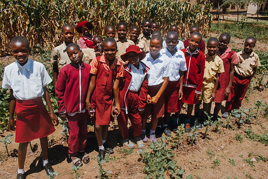 EDIT_49Kwenda Primary School group photo in garden.jpg