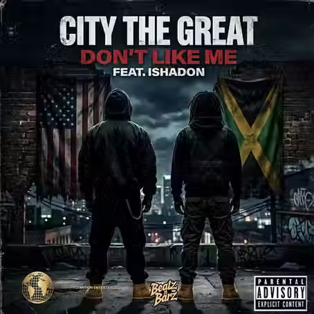City the Great "Don't Like Me" featuring two hooded figures standing in on a rooftop with American and Jamaican flags, dark city skyline, and bold hip-hop artwork.