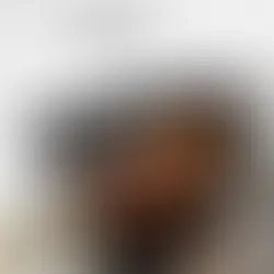 Torn-paper collage showing a close up of Juvenile wearing a white hat and trimmed beard, with the upper portion in grainy black and white and the lower portion in color. A beige label reads ‘BBB.’ with Megan Thee Stallion and DJ BAD THA PROBLEM, and a parental advisory badge appears in the corner.