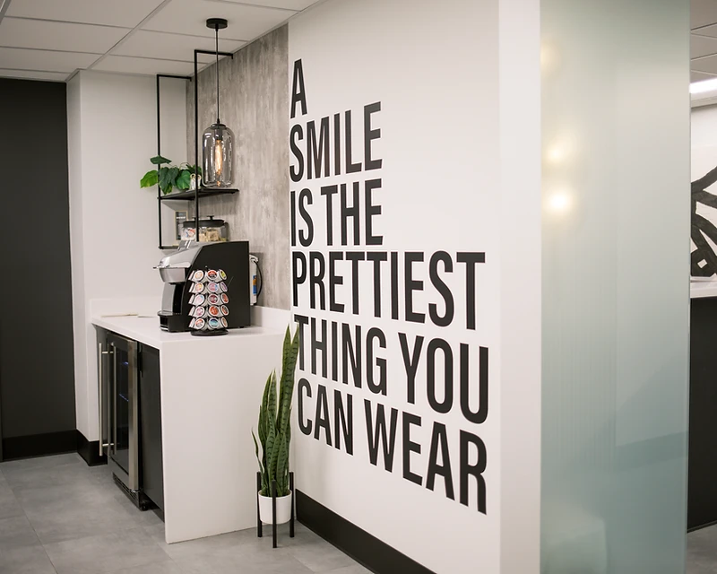 HE Dental entrance with wall art: A smile is the prettiest thing you can wear
