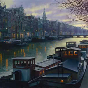 Boats on the canal in Amsterdam at sunset