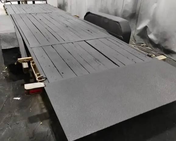 A flatbed trailer with a flat bed attached to it