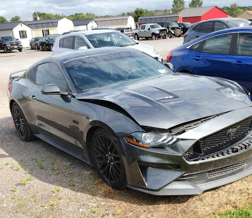 A car that is sitting in the dirt