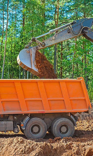 very-close-up-view-pouring-ground-from-scoop-exkavator.jpg