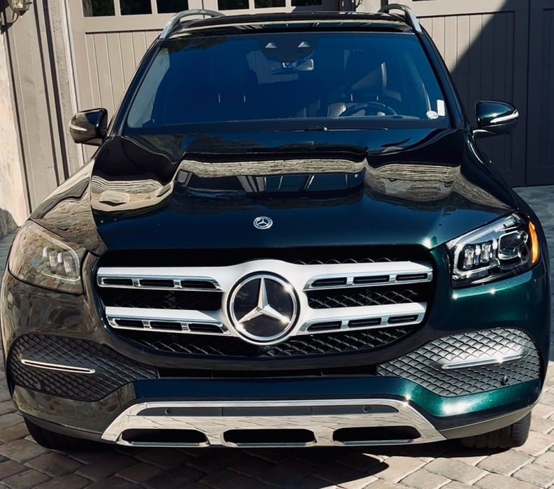 Restored Mercedes SUV with corrected paint, enhanced gloss, and deep interior extraction