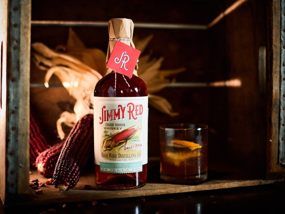 High Wire Jimmy Red Straight Bourbon bottle at 95 proof alongside red corn
