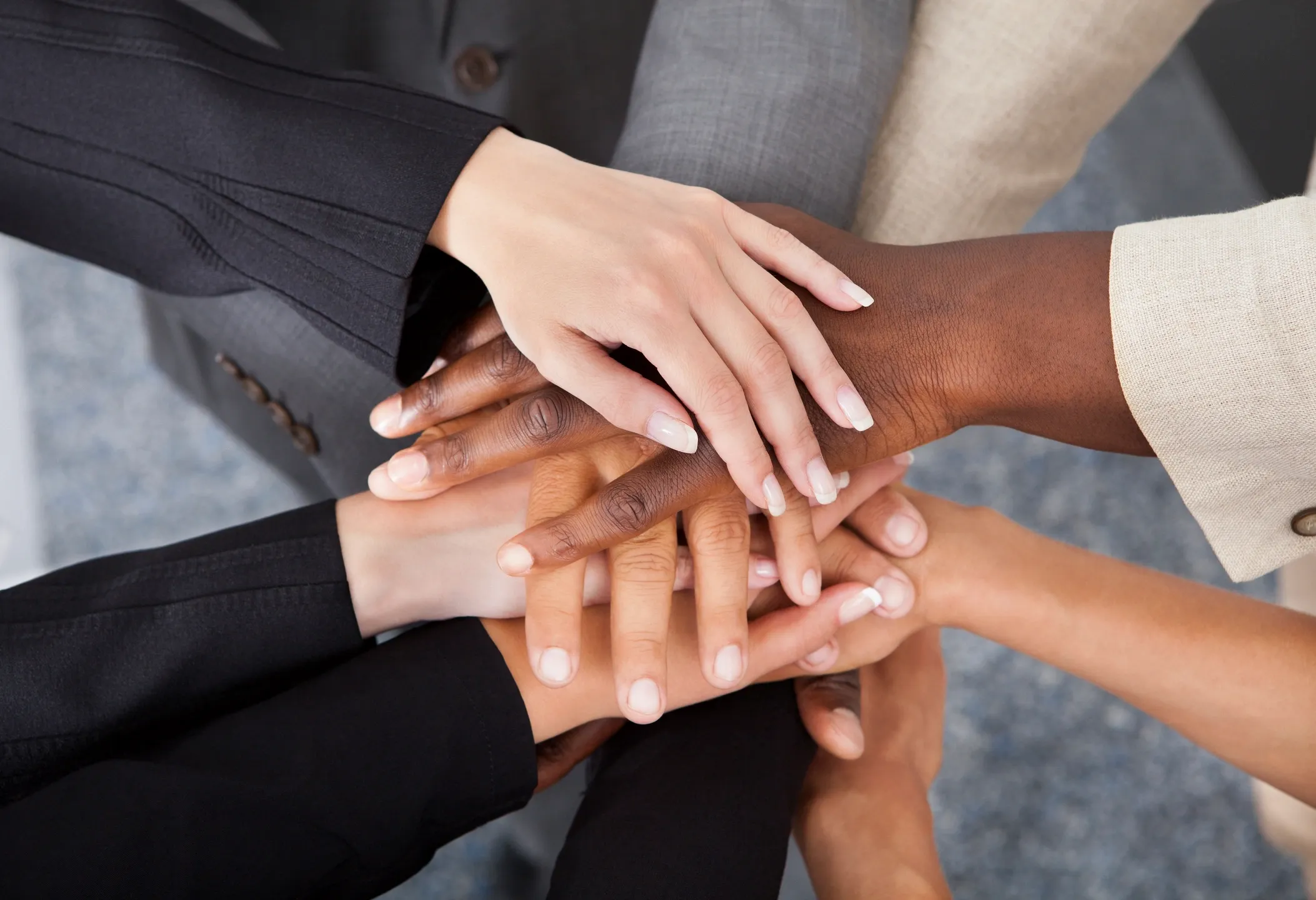 hands atop more hands