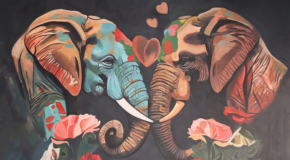 Vibrant elephant wall mural, trunks form heart, flowers