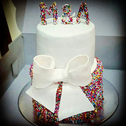 #Sprinkles galore! #2tier #darkchocolate #cake with #FerreroRocher cake covered in #white #fondant #