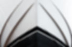 The bow of the yacht, bottom view, close-up. The waterline is clearly visible. Front of a