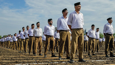 RSS exercising with their trademark sticks. Photograph: Kamal Kishore/Reuters