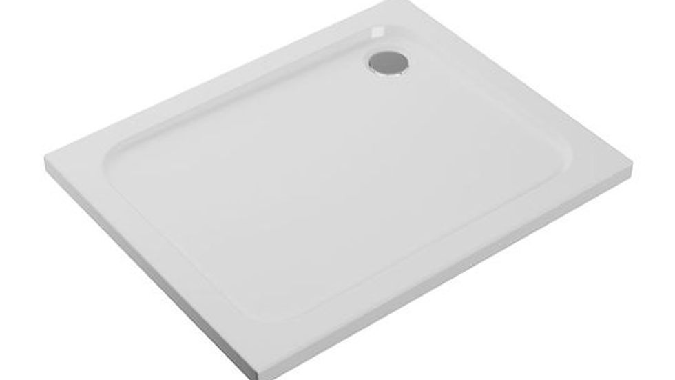 Close-up view of a stone resin shower tray in a sleek bathroom