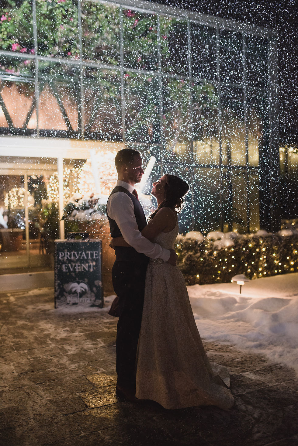 Bride and groom at winter wedding with snow