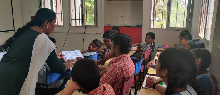 An image of a teacher trainee demonstrating her skill in an inclusive classroom during the University practical exam