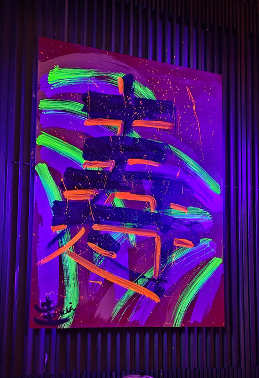Blacklight painting by Japanese calligraphy artist Kei Murakami at the grand opening of Japon at the Setai hotel in Miami Beach, FL.