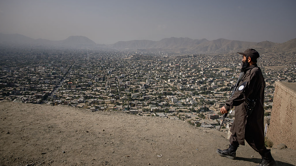A Taliban policeman looks over Kabul, Afghanistan. The EC has proposed working with the Taliban. (Elke Scholiers/Getty Images)