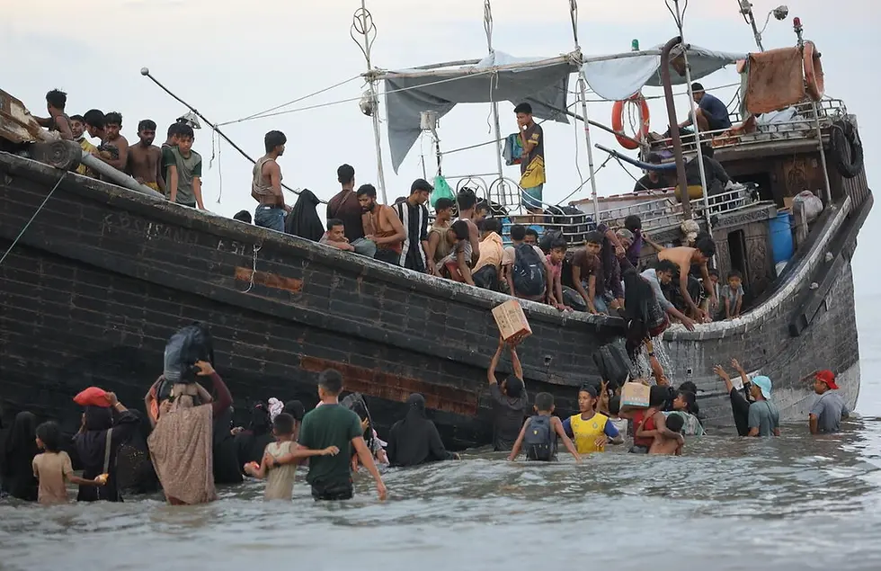 Rohingya refugees disembark from a vessel in Ulee Madon, in Indonesia's North Aceh, in November 2023. | © UNHCR/Amanda Jufrian