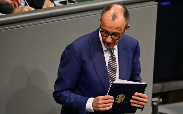German Chancellor Friedrich Merz leaves after delivering a speech on Foreign policy at the Bundestag, on January 29, 2026, in Berlin. (Tobias SCHWARZ / AFP)