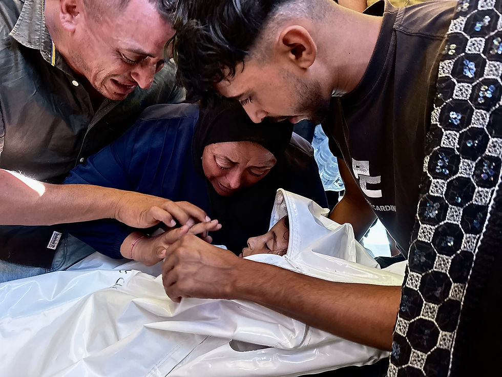 Relatives mourn the death of eight-year-old Amal al-Mughayir, who was killed in an Israeli airstrike that targeted tents housing displaced people in the al-Mawasi area of Khan Younis, in the southern Gaza Strip, September 16, 2026. (Doaa Albaz/Activestills)