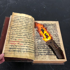 Red-Hot Stone Ritual Knife in Archaic Bible